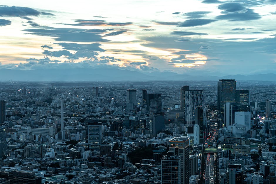 Aerial view of Tokyo at dusk with dramatic cloud formations