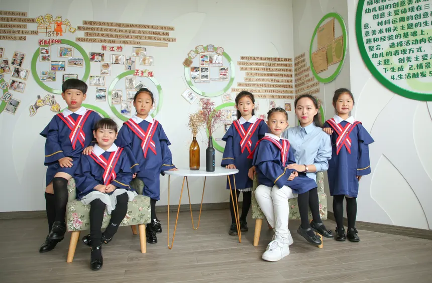 Children in uniforms with teacher in educational setting, learning atmosphere.